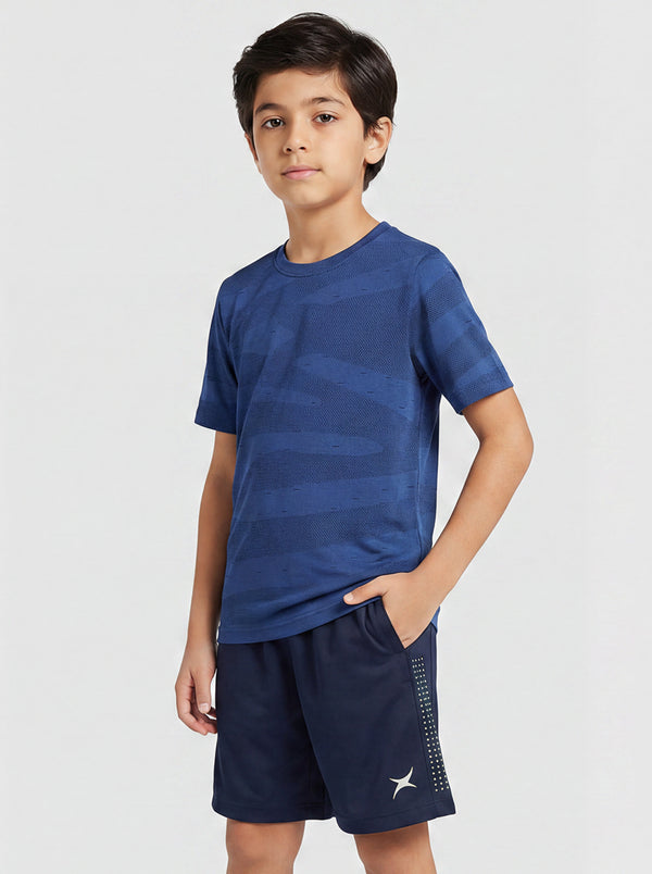 Child wearing a blue sports outfit on a white background