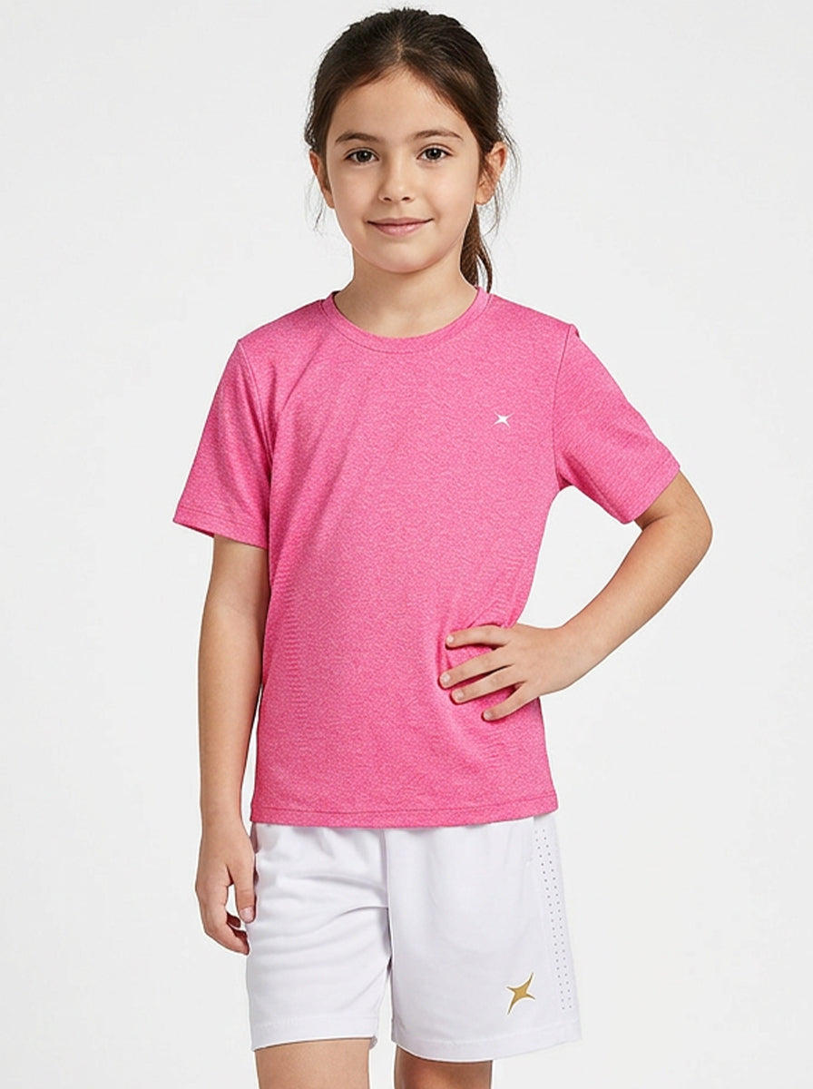 A girl wearing a pink sports T-shirt and white shorts on a white background