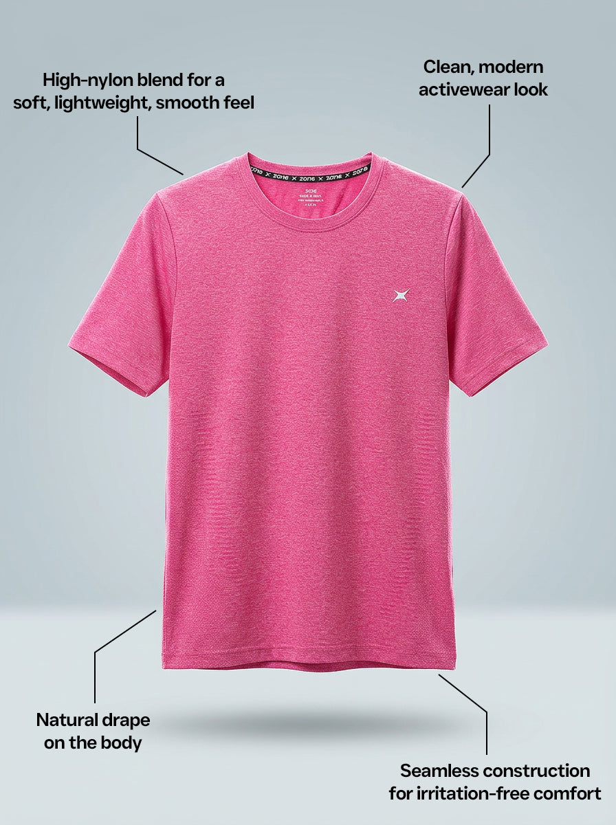 Pink t-shirt on a gray background with text describing features