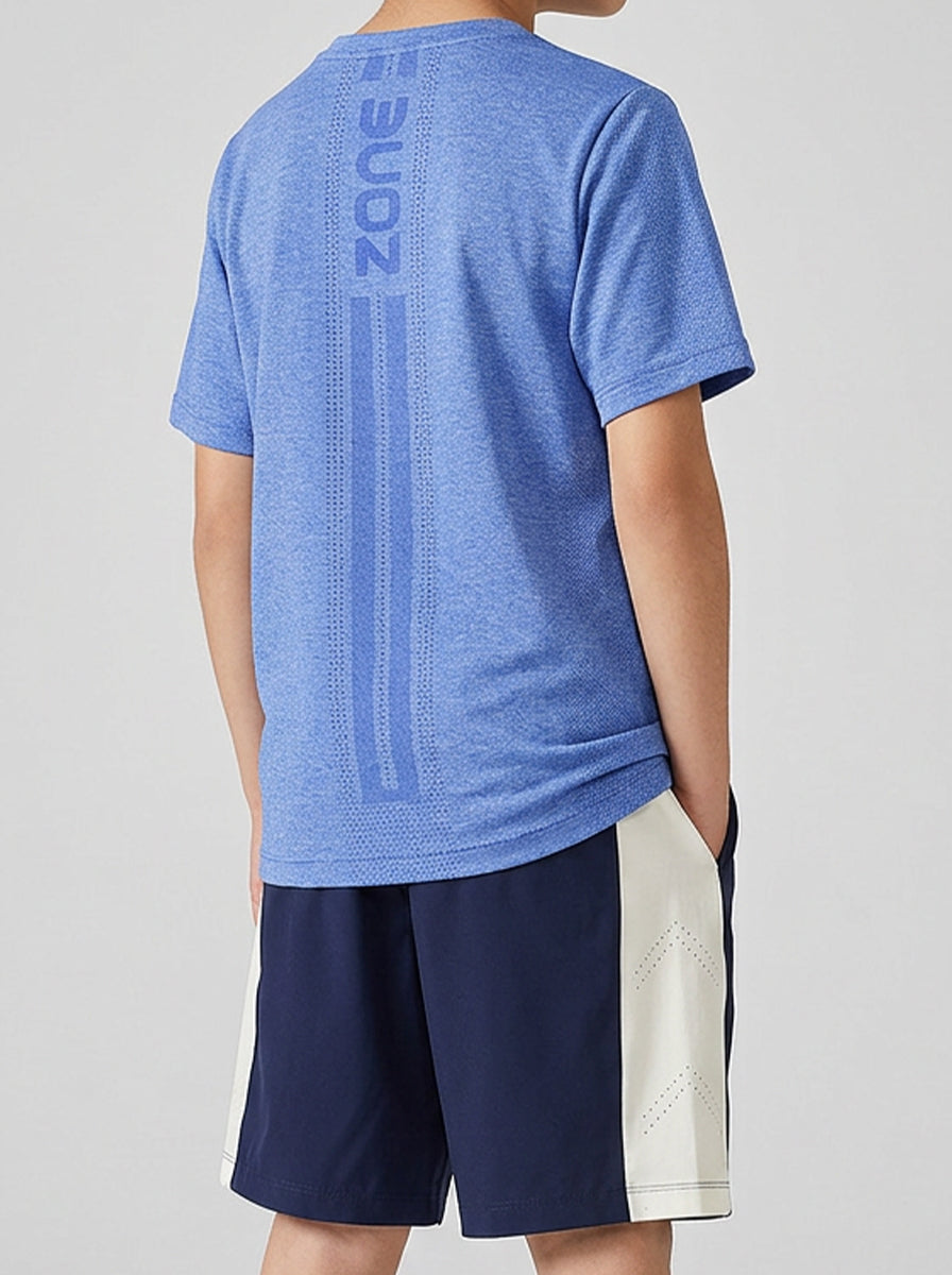 A boy wearing a blue sports t-shirt with 'Zone' branding on the back, paired with navy shorts.