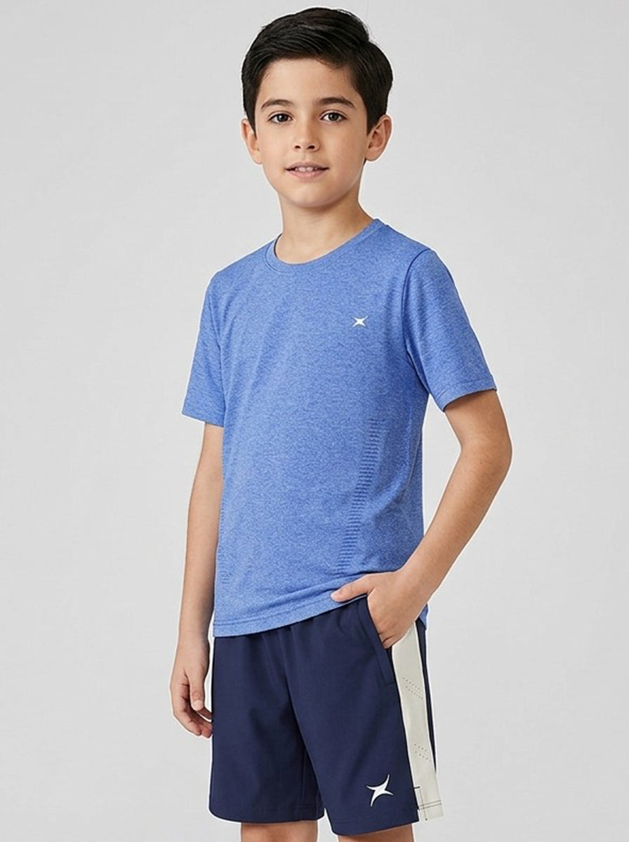 Child wearing a blue sports t-shirt and navy shorts with a white stripe on a light gray background