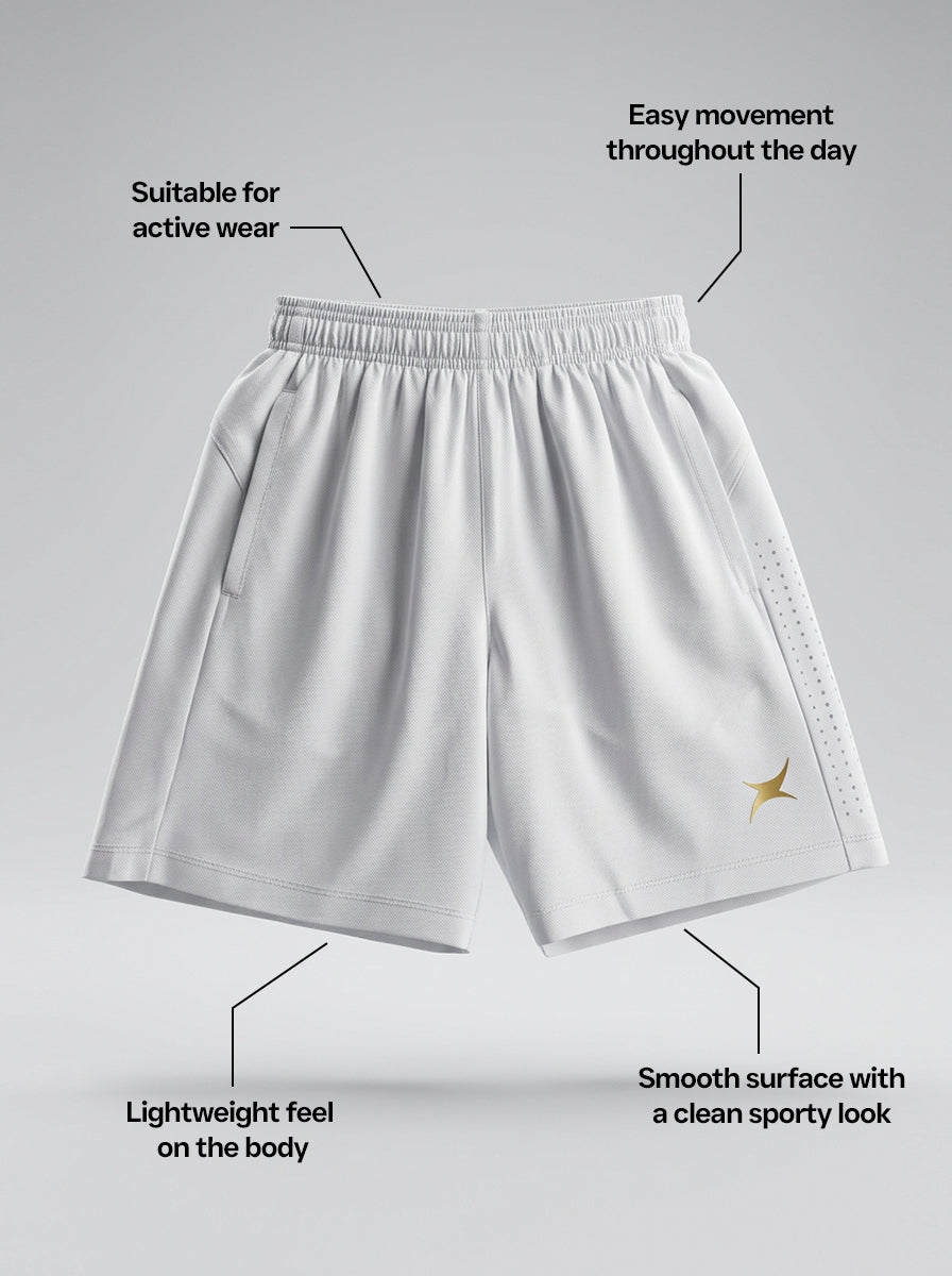White sports shorts with text highlighting features on a gray background